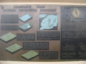 Bronze plate in Carmen's Chocolate Hills Complex explainging the origin of the hills