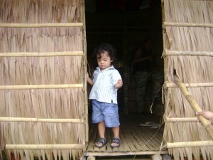 My Aki exploring the house of the Subanen tribe;that man behind him was waiting to take his shot of my sweetie